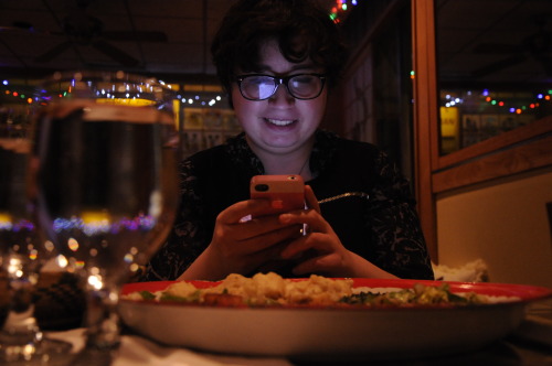 1. Light:Julianna Nunez, 21, Checks A Text From Her Boyfriend Over A Dinner Of Fish And Spinach With