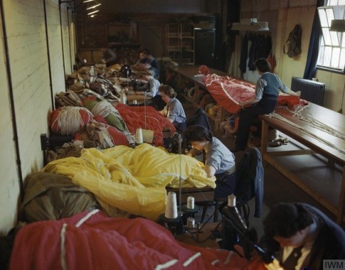 WAAF members on an RAF glider station in Britain repairing &amp;packing parachutes, to be used by ai