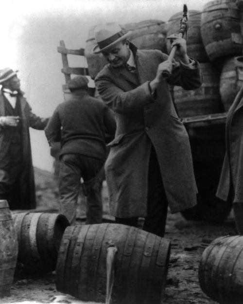 Alcoholic beverages being poured out during the Prohibition of the 20s