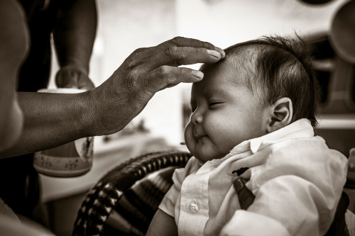 “A Precious Blessing“A Navajo infant receives a blessing from his father at his First Laugh Ceremony