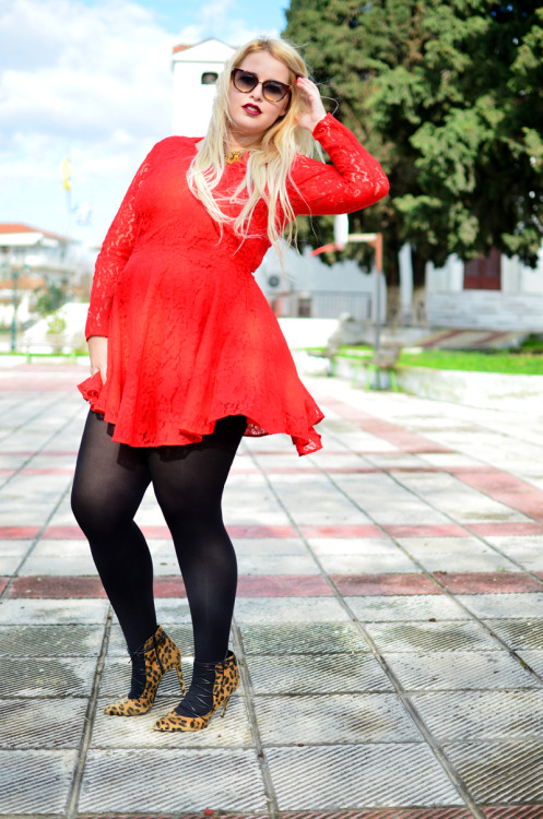 Black pantyhose with short red lace dress, leopard print high heeled shoes and heart shaped sunglass