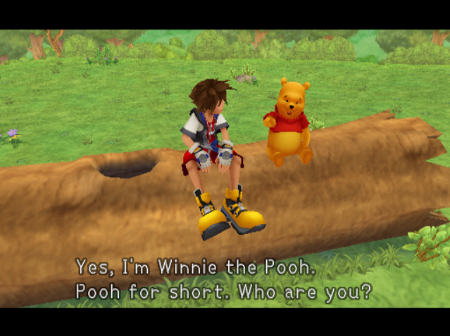 Sora and Pooh sitting on a log in 100 Acre Wood. Pooh is saying,'Yes, I'm Winnie the Pooh. Pooh for short. Who are you?' 