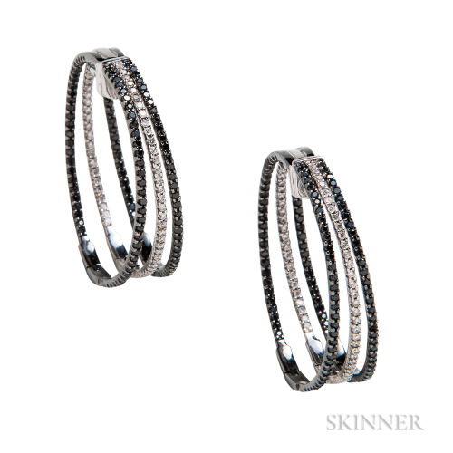 Diamond, black diamond, and white gold earrings (at Skinner)