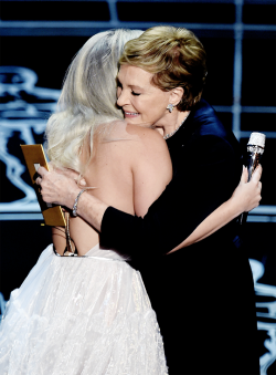 kinginthenorths: Julie Andrews hugs Lady Gaga on stage at the 87th Oscars February 22, 2015 in Hollywood, California