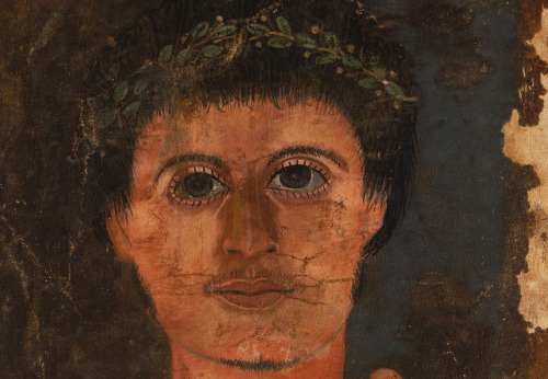 With youthful and lively eyes, early beard and mustache growth, this depiction of a young man is unr