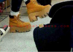 unphazedcat:  left: image from ‘hot ghetto mess.com’ thick soled tims on a black girl right: image from fashion shoot thick soled tims on k-rapper Glime its just funny how stuff that is ghetto on us is fashion and cool everywhere else. 