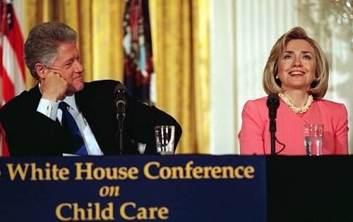 The look of love WASHINGTON, : US President Bill Clinton listens to his wife Hillary speak to an aud