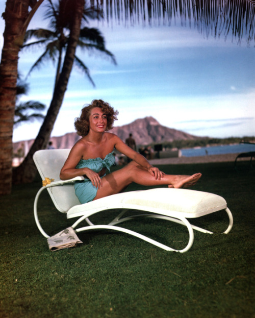 Joan Crawford near a poolside, 1950’s.