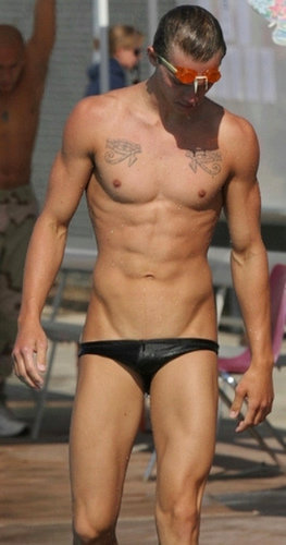 coolbrandonanthonythings:Apparently this sexy male is rocking two speedos at the same time, a skimpy one on top of a fuller one, but in the 2nd pic someone has pixelled out the one underneath.  No matter; with that magnificent long torso, tall tan hard