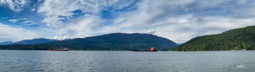 Tankers in the BayPanorama of the sea and mountains with a couple of ships waiting out in the bay. A