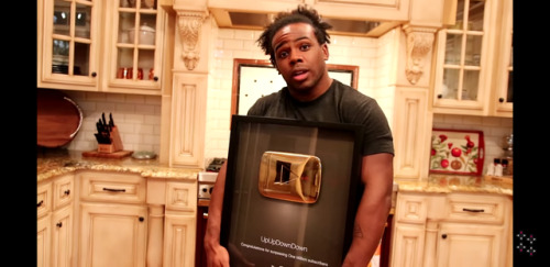 crookedmoonsaultpunk: UpUpDownDown got it’s golden play button! Xavier is going to turn it to a belt!