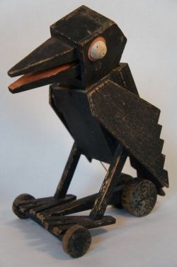 ayellowbirds:  blushingcheekymonkey:  early 20th century crow pull toy  this absolutely looks like something that would start talking to you at either the worst or best possible time. 