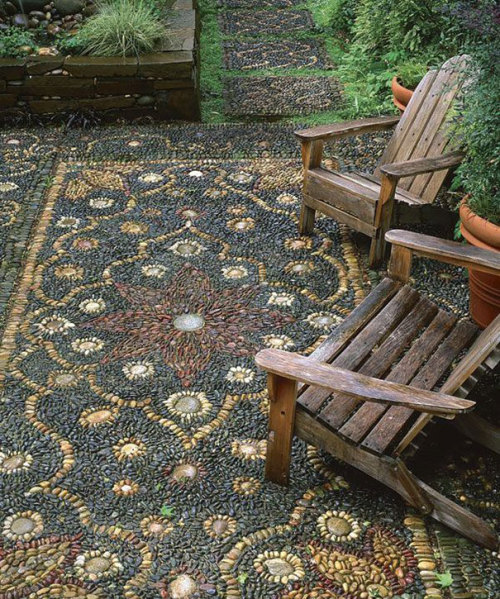 asylum-art:  10 Magical Pebble Paths That Flow Like Rivers   The garden or back-yard is one of the best places in a home for the home-owner to express their creative side. Why surround all those beautiful plants with an ugly path when you can create a