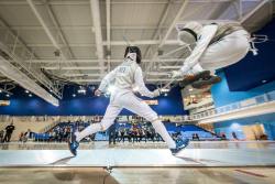 modernfencing:[ID: two foilists in a bout. The fencer on the right is jumping in a way that looks like he’s doing a cannonball.]  Fencing at the 2015 Junior Pan Ams!