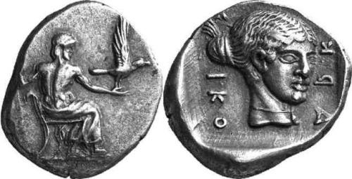 Silver hemidrachm of the Arcadian city of Tegea.  On the obverse, Zeus Lykaios, seated, with an eagl