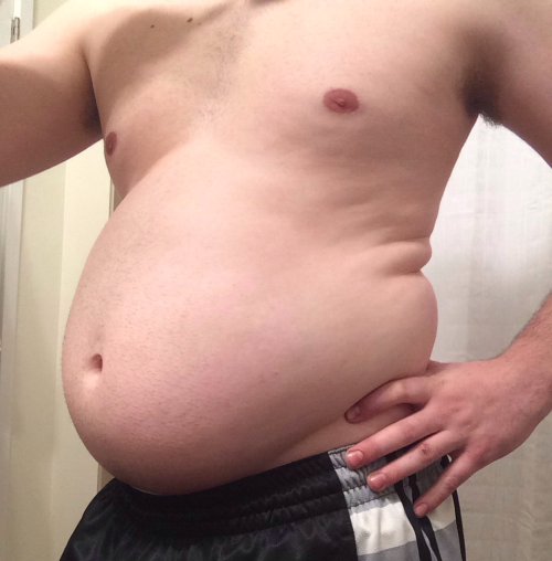 bellylover111:  So I obviously keep growing 😏  Im so stuffed and inflated… It hurts to move, I feel so huge and round! I decided to see how much i could eat tonight and then seeing and feeling the massive size of my giant gut decided ‘hey why not