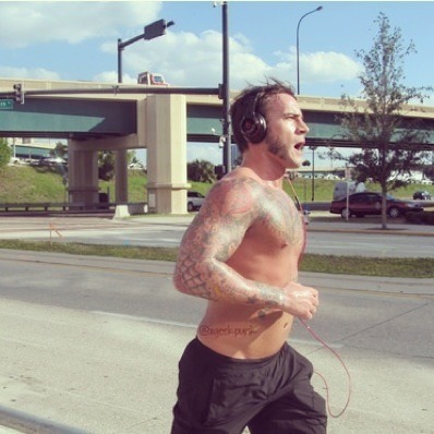 abrokenframeofmine:  Punk jogging before Raw (;  (Credit to; chicagomadex)  Jogging shirtless…and it looks like he is going commando under those shorts to! O.O