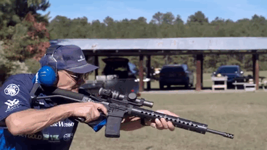 gunrunnerhell:  Jerry Miculek “3 in the body, 2 in the head, half-a-second” AR-15