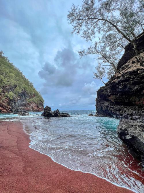 amazinglybeautifulphotography: Naturally red sand of Kaihalulu Beach, Hawaii USA [OC][3024 x 4032] -