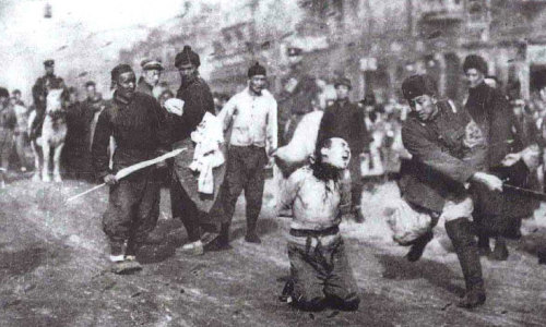 historicaltimes:Japanese soldier beheads man in the street during The Rape of Nanking 1937 via reddit