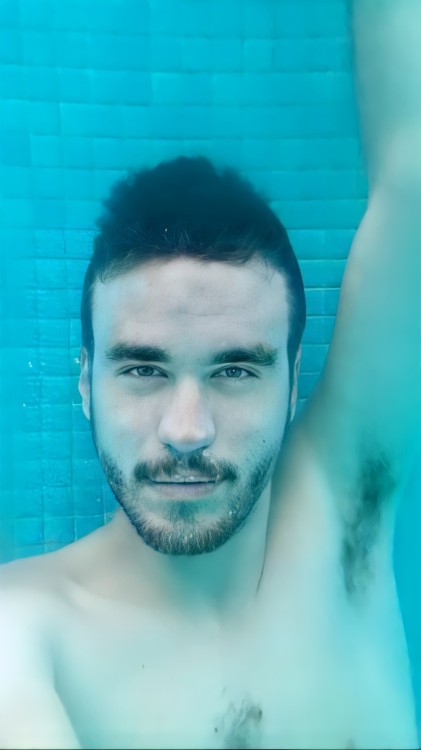 Showing hairy pits barefaced underwater