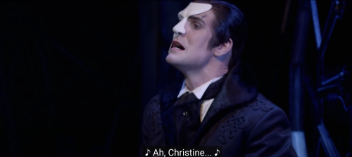 screengrabsoutofcontext: [Image Description: The Phantom from the chest up looking to the left, sing