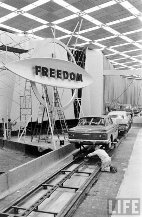 Setting up the Wheels of Freedom car display(Robert W, Kelley. 1960?)