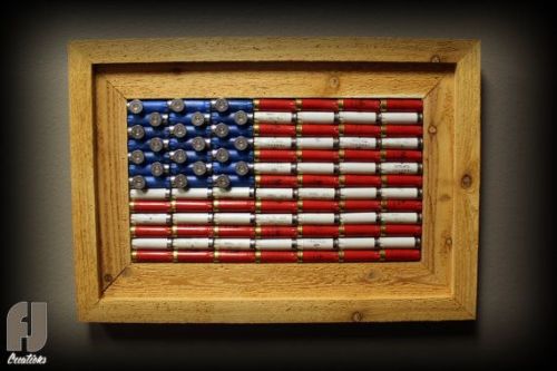 gunrunnerhell:  Shotgun Shell FlagCustom made to order decorative American flag made of red, white and blue shotgun shells by FJ Creations. I’m not 100% sure they still make these but you can contact them in the link below to check. (GRH)Source