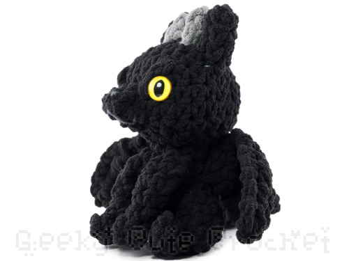 Black dragon with yellow sparkly glow-in-the-dark eyesJust one available here: https://www.etsy.com/