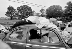 psychedelicway:  A girl naps on top of her car, while trying to reach the music festival at Woodstock, N.Y., Aug. 16, 1969. 