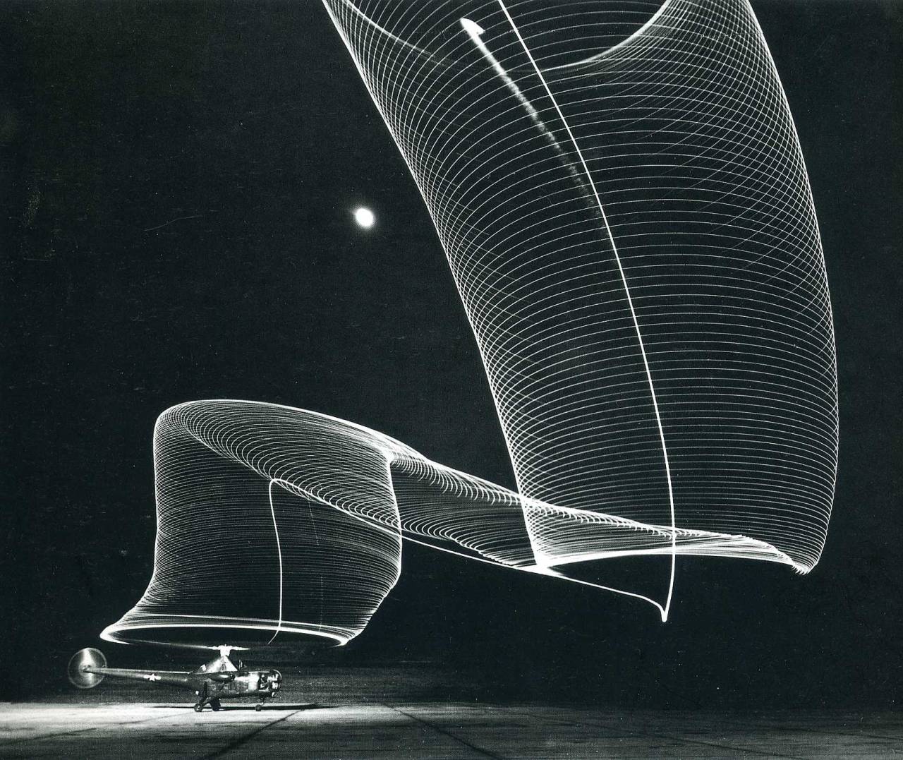 blazepress:  Long exposure of a helicopter landing at night.