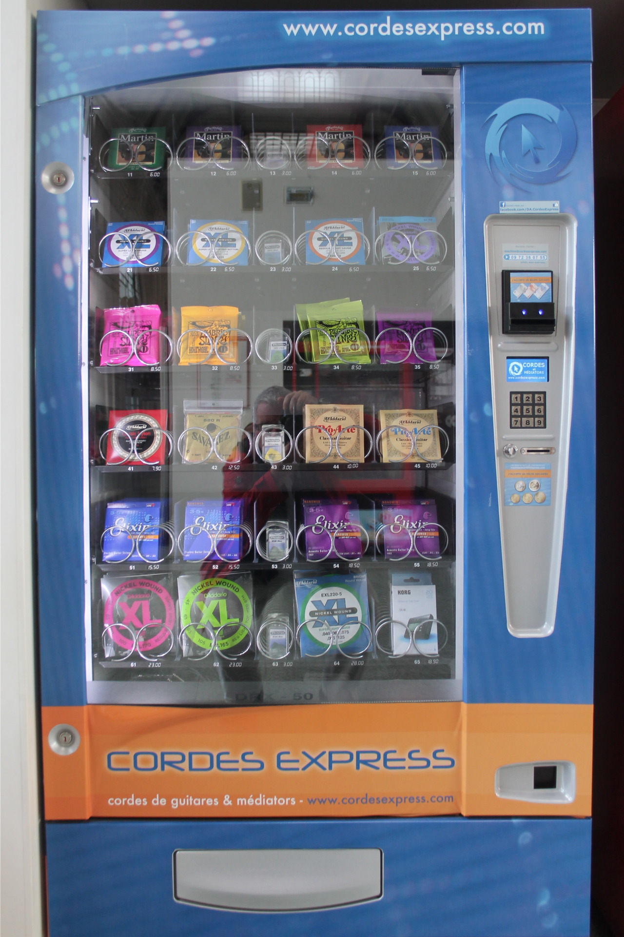 a vending machine, at a train station
but what does this machine sell?
answer: guitar strings
