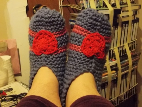 i knit these slippers for my moirail for christmas! as soon as i learned how to crochet hearts i was