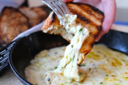 myfavoritehotstuff:  gastrogirl:  garlic and herb skillet fondue with grilled bread.  Apparently I’m hungry! 