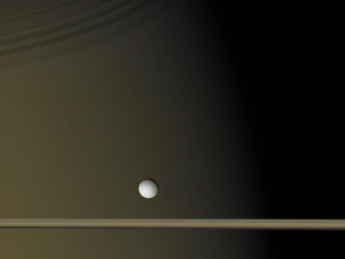 gravitationalbeauty: Enceladus Near Saturn