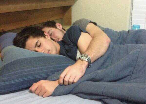 Cute gay guys cuddling