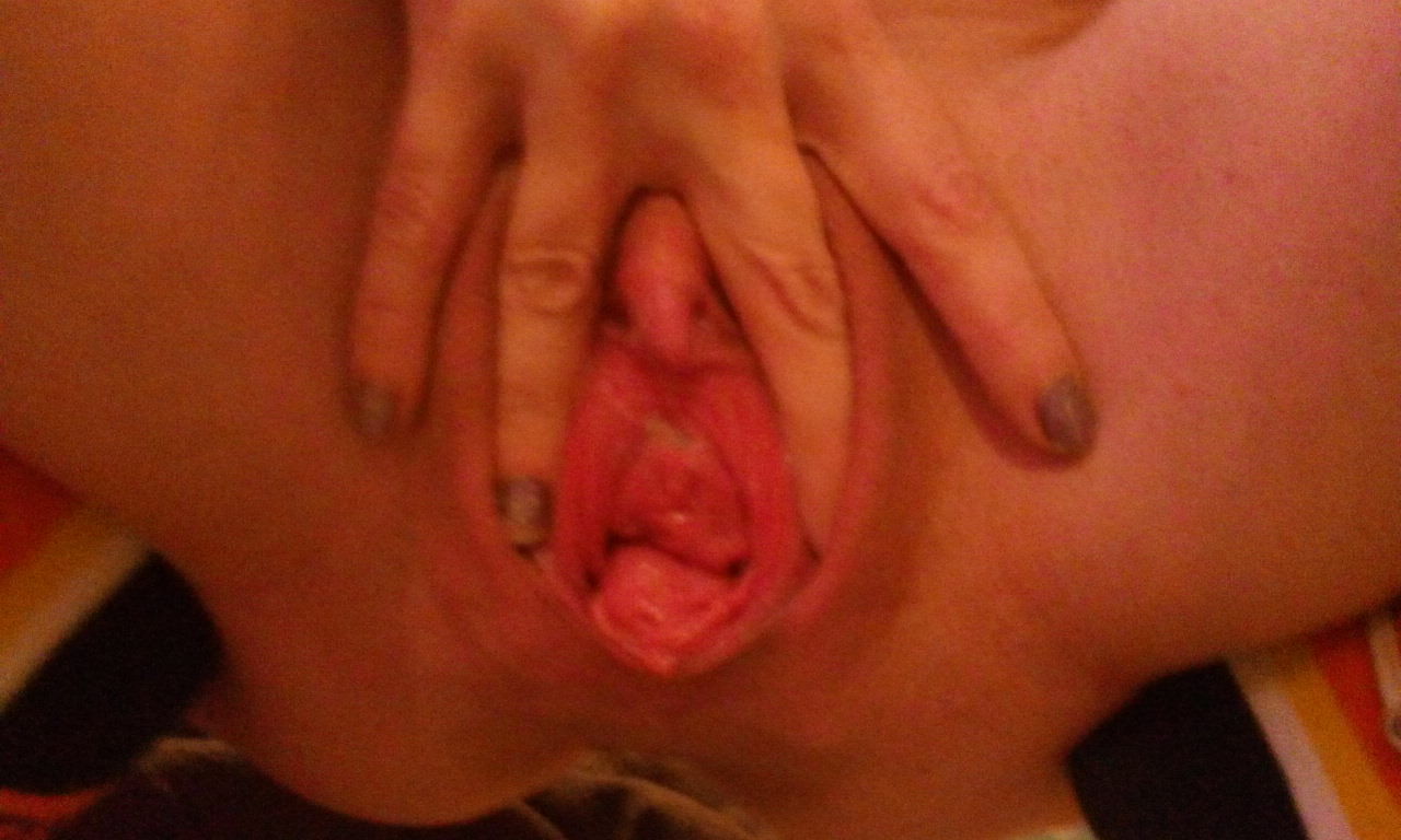 What a monstrously huge pussy. The stem of her clit is engorged and the whole thing