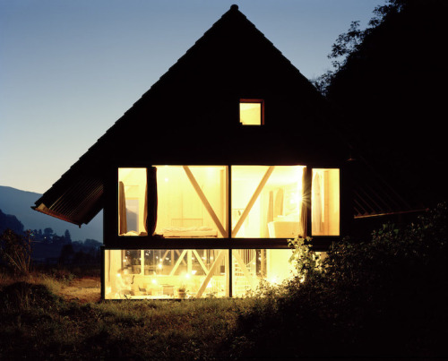 doeyzooey:  Zurich-based architect Pascal Flammer designed this timber house in Balsthal, Switzerland, which is sunken 2.46ft (75cm) with ground-level wrap around windows, connecting it with nature in a special, unique way.  Please….. I want it