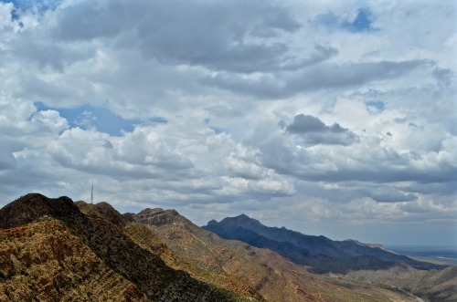 djk915: El Paso, TX. Clouds casting a shadow on clear sedimentary layering - look how the layering f