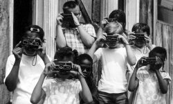 steroge:  Children taking photographs using