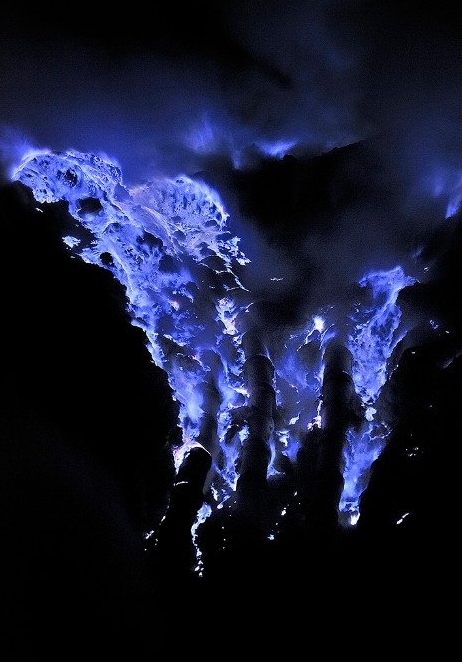 end0skeletal:  The blue flames of Indonesia’s Ijen volcano are caused by super-heated sulfuric gases forcing their way to the surface. Upon hitting open air, the gases ignite, sometimes shooting flames as high as 16 feet.   Some of the gases condense