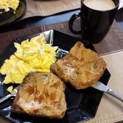 Cinnamon French Toast topped with peanut butter and scrambled eggs