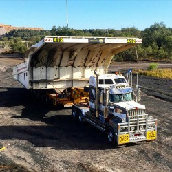 semitrckn:  Kenworth custom T909 with a Big haul truck body on wagon 