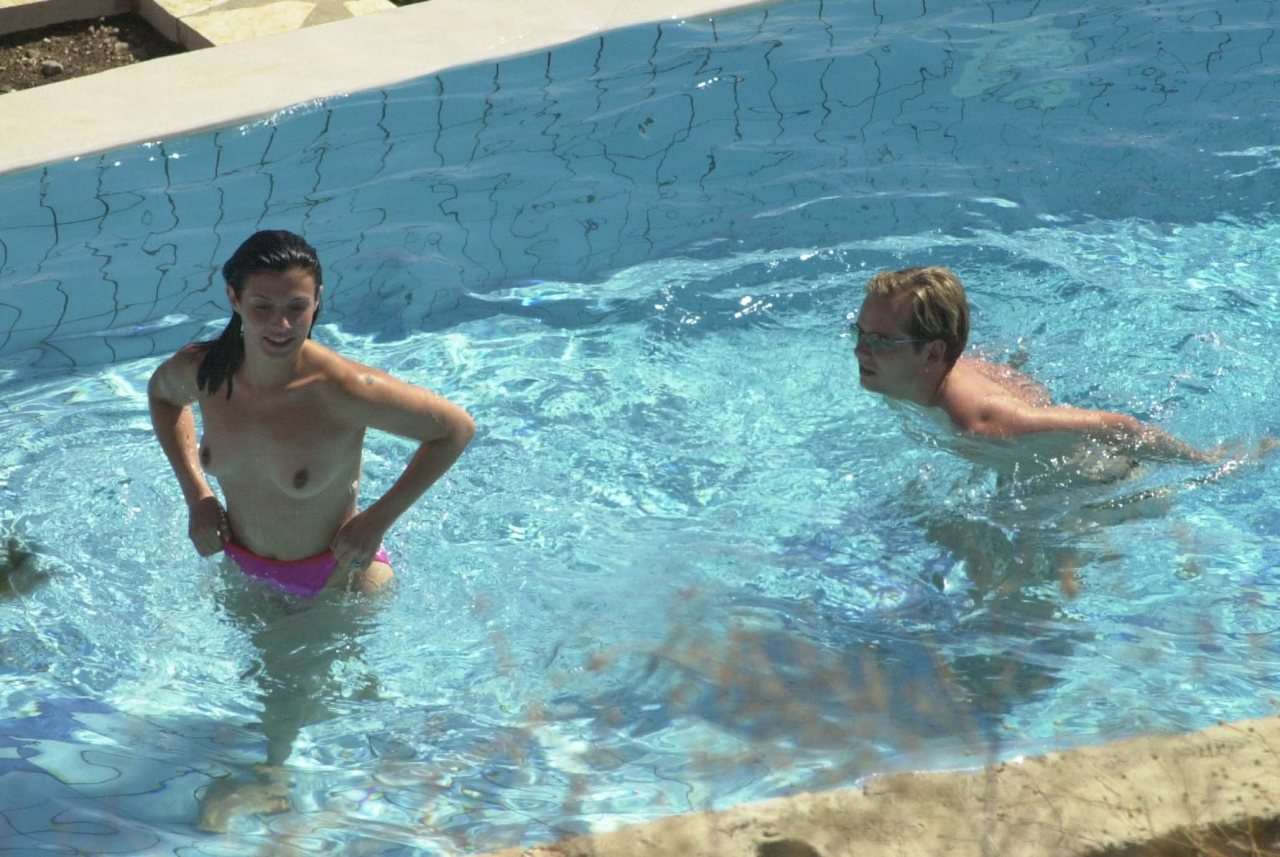 toplessbeachcelebs:Kym Marsh (British Model) swimming topless in a pool (August