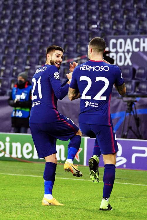 Yannick Carrasco celebrates with Mario Hermoso after scoring vs. Red Bull Salzburg — December 9, 202