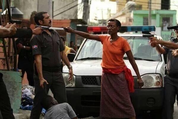     Haitian woman defending her son in the Dominican Republic.  This picture is raw