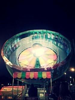 bloodyqueefs:  Velocity. Being thrown about in the night sky, surrounded by neon lights is really fucking peaceful.  Riding fair rides is becoming one of my favorite things. 