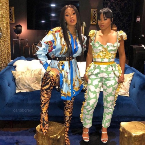 Cardi B wearing Versace Spring 2018 styled with a pair of Balenciaga boots.