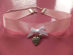 collarkitty:  Also this collar. Eventually I want to have a beautiful pastel pink leather collar with D rings and a heart shaped lock, but this collar is just beautiful. The ribbon would get destroyed but if I wore it only on special occasions…..Need