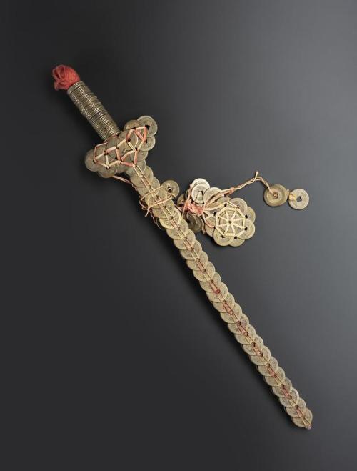 ivan-fyodorovich: centuriespast: Magic sword consisting of an iron rod covered with coins arranged i
